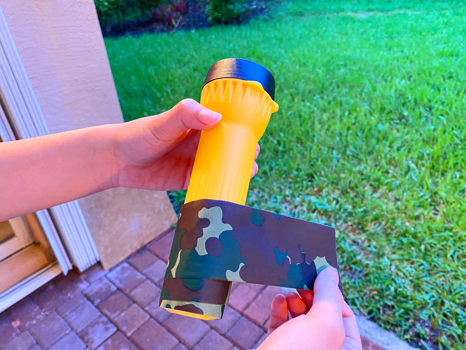 duct tape camo being used to wrap a flashlight