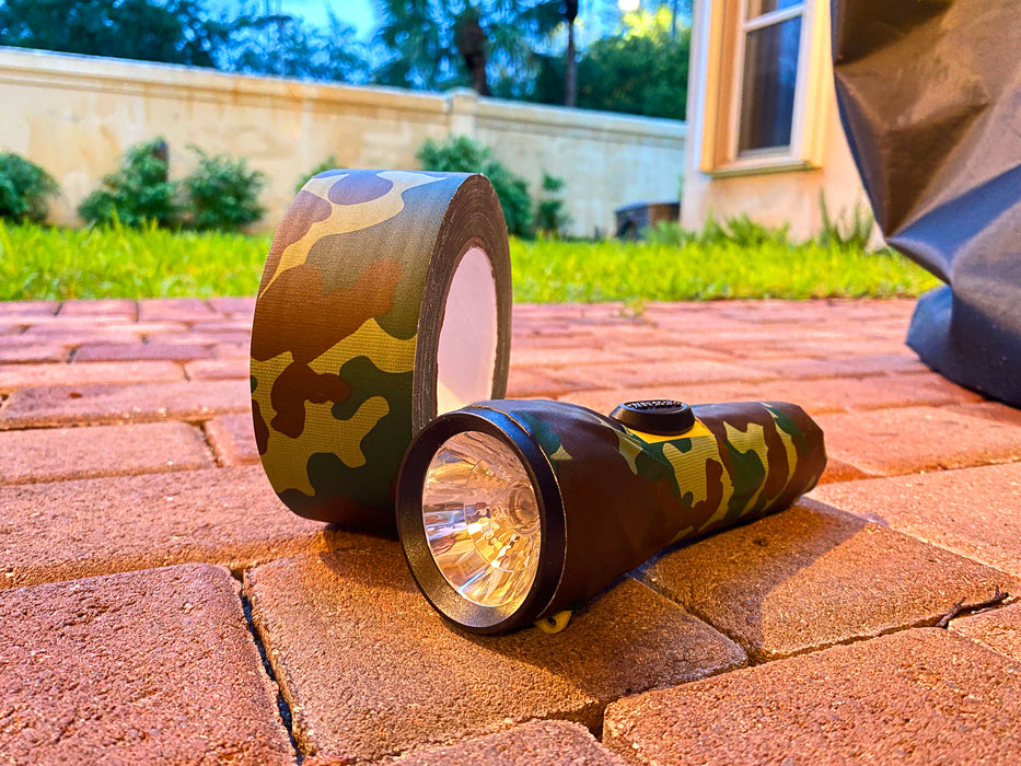 camo duct tape used to decorate camping flashlight