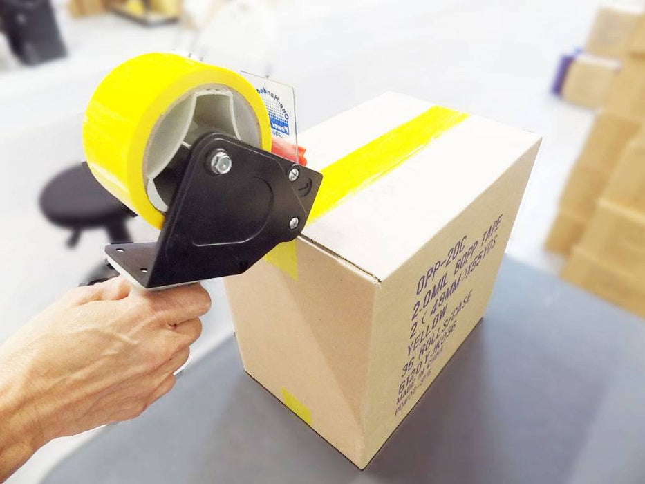 Colored Carton Sealing Packaging Tape with Acrylic Adhesive - Yellow - used with hand held dispenser to seal a shipping box