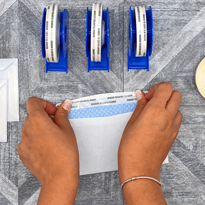 double sided tissue tape applied on edge of an envelope for sealing