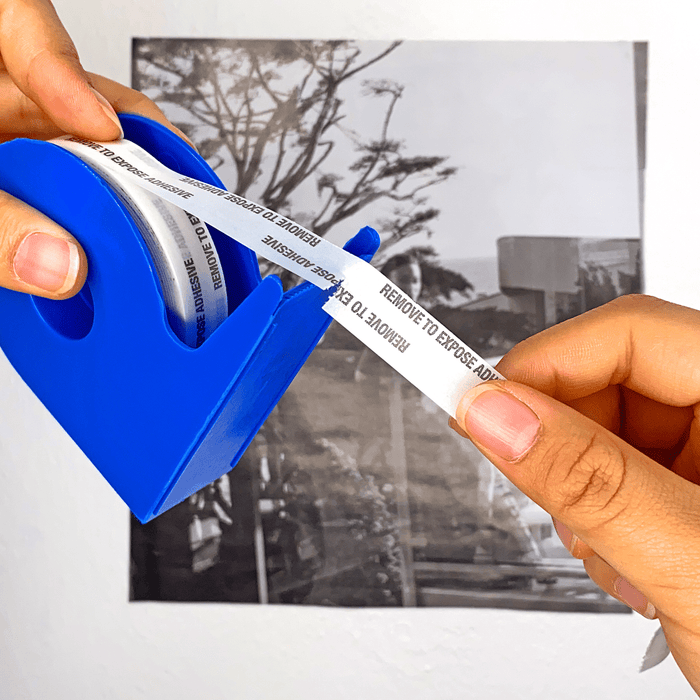 Tissue tape double sided being ripped with its tape dispenser