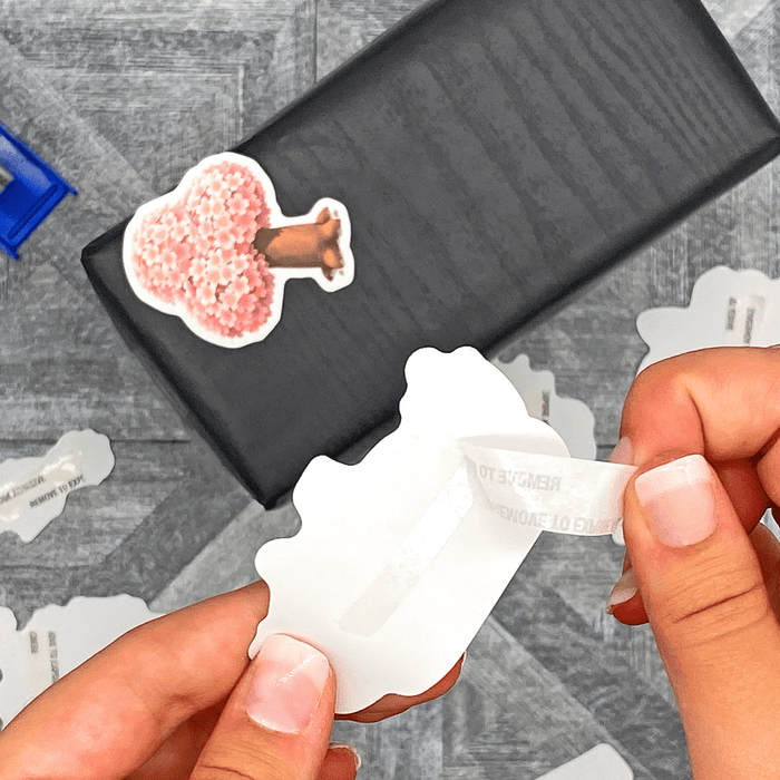 double sided tissue tape applied onback of printout to make it a sticker