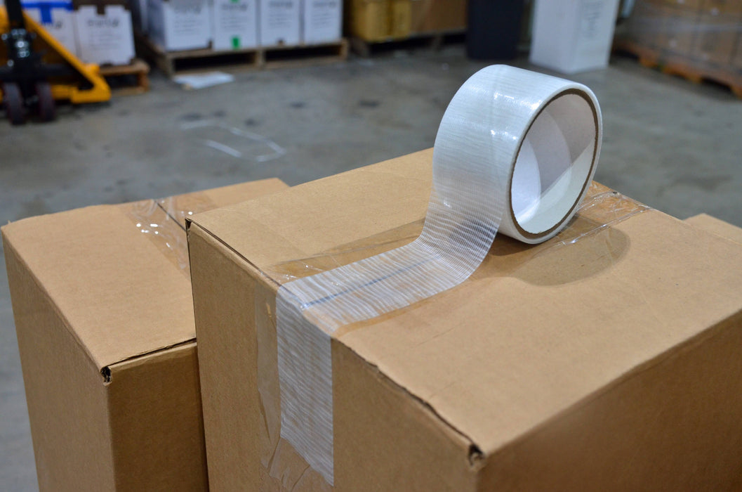 clear duct tape near me used to sea a brown shipping box