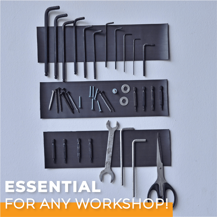 Picture of a magnetic tape installed onto a workshop wall to hold tools and other metal objects