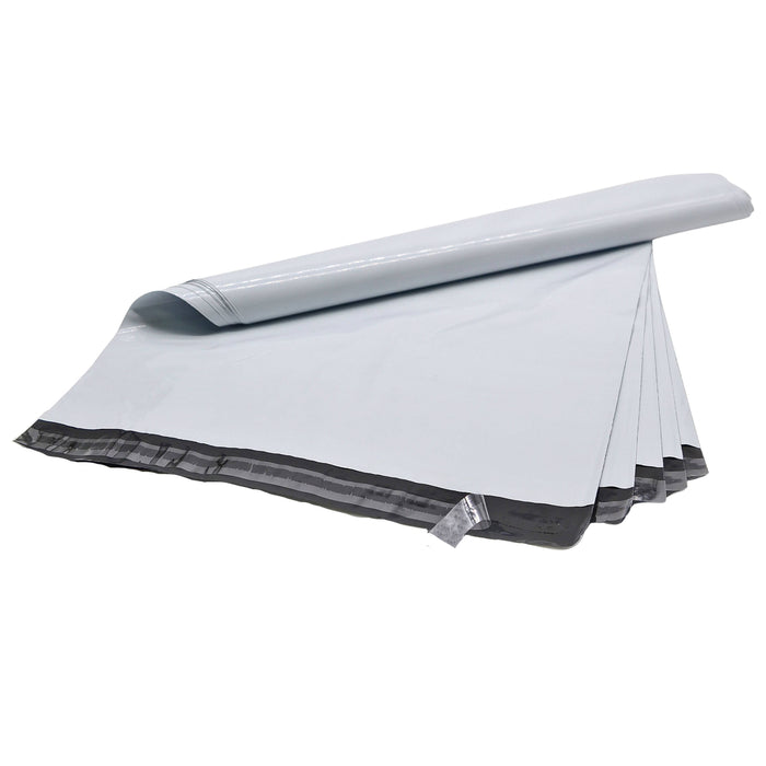 Multitude of White Poly Mailer Bags self sealing adhesive plastic mail bag