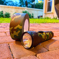 camo duct tape used to decorate camping flashlight