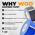 Black gaffers tape being used to secure and organize computer cables in an. Office