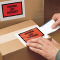 Shipping box with an envolope saying  "Packing List Enclosed" in bright red and black letters