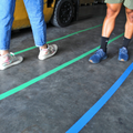 floor tape lines of different colors made with tape applicator tool