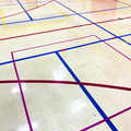Gymnasium floor tape marked lines of different colors