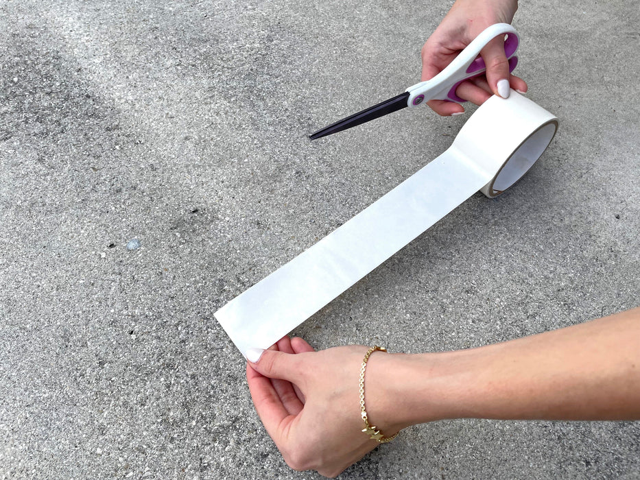 Double Sided Polypropylene Tape being used on concrete floor
