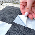Double Sided Polypropylene Tape being applied on carpet and backing being peeled off