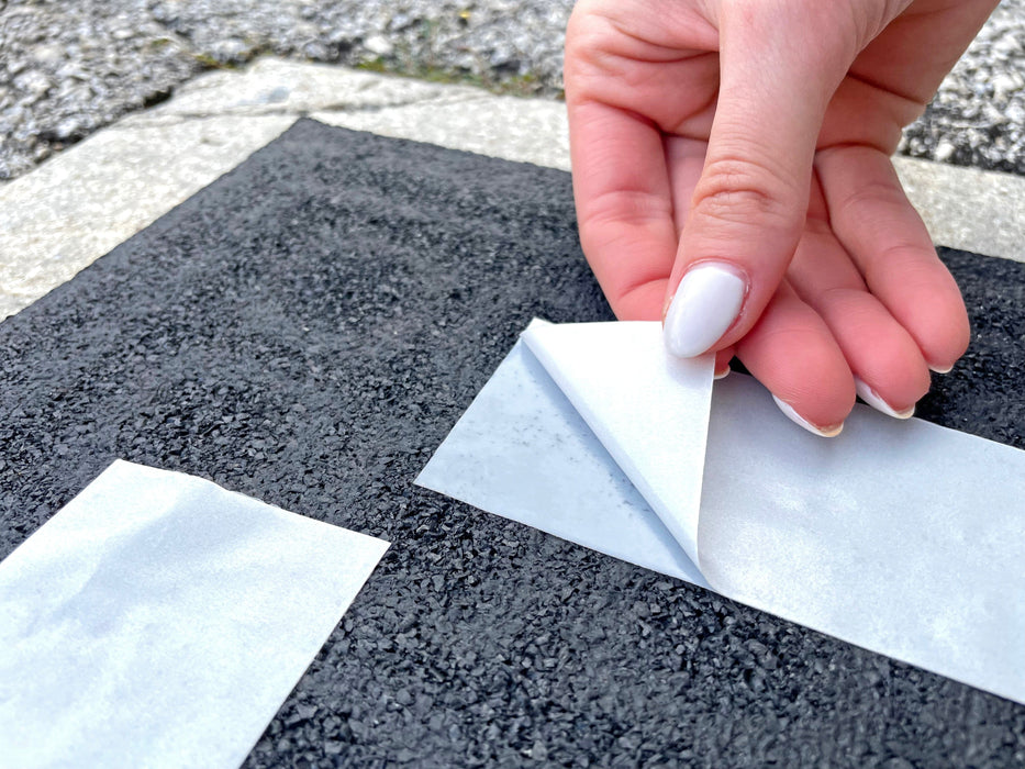 Double Sided Polypropylene Tape being applied on carpet and backing being peeled off