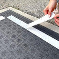 Double Sided Polypropylene Tape being applied on carpet and backing being peeled off