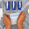 double sided tissue tape applied on edge of an envelope for sealing