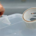 transparent duct tape being used to repair clear plastic bin