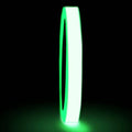 Close up of glow in the dark tape roll glowing - 3/8 inch