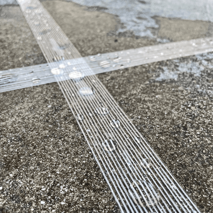 Close up of filament tape on wet ground