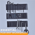 Picture of a magnetic tape installed onto a workshop wall to hold tools and other metal objects