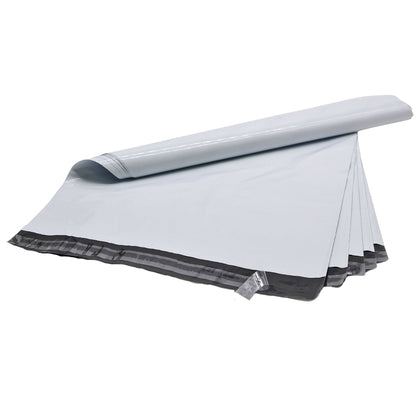 Multitude of White Poly Mailer Bags self sealing adhesive plastic mail bag