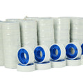 Mulitple stacked rolls of white PTFE Pipe Thread Seal Tape shrink wrapped for sale in bulk