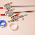 Roll of pipe thread sealant tape alongside a threaded tool with PTFE on threads