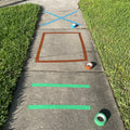 Shapes and stripes made with colored floor marking tape applied on concrete sidewalk 