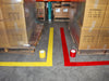 Floor markings made with bright yellow and red vinyl floor tape