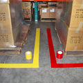 Floor markings made with bright yellow and red vinyl floor tape