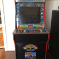 Old-school gaming console decorated with red accents of red vinyl floor tape