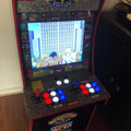 Old-school gaming console decorated with red accents of red vinyl floor tape